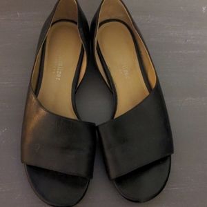 Naturalized asymmetrical sandals